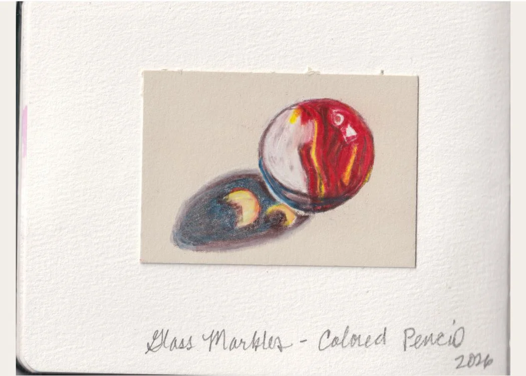 Glass Marble #1 — colored pencil sketch of a red and yellow glass marble with a long blue shadow